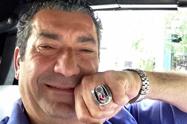 Luigi Militello with the Red Sox World Championship ring he found in his Manhattan restaurant